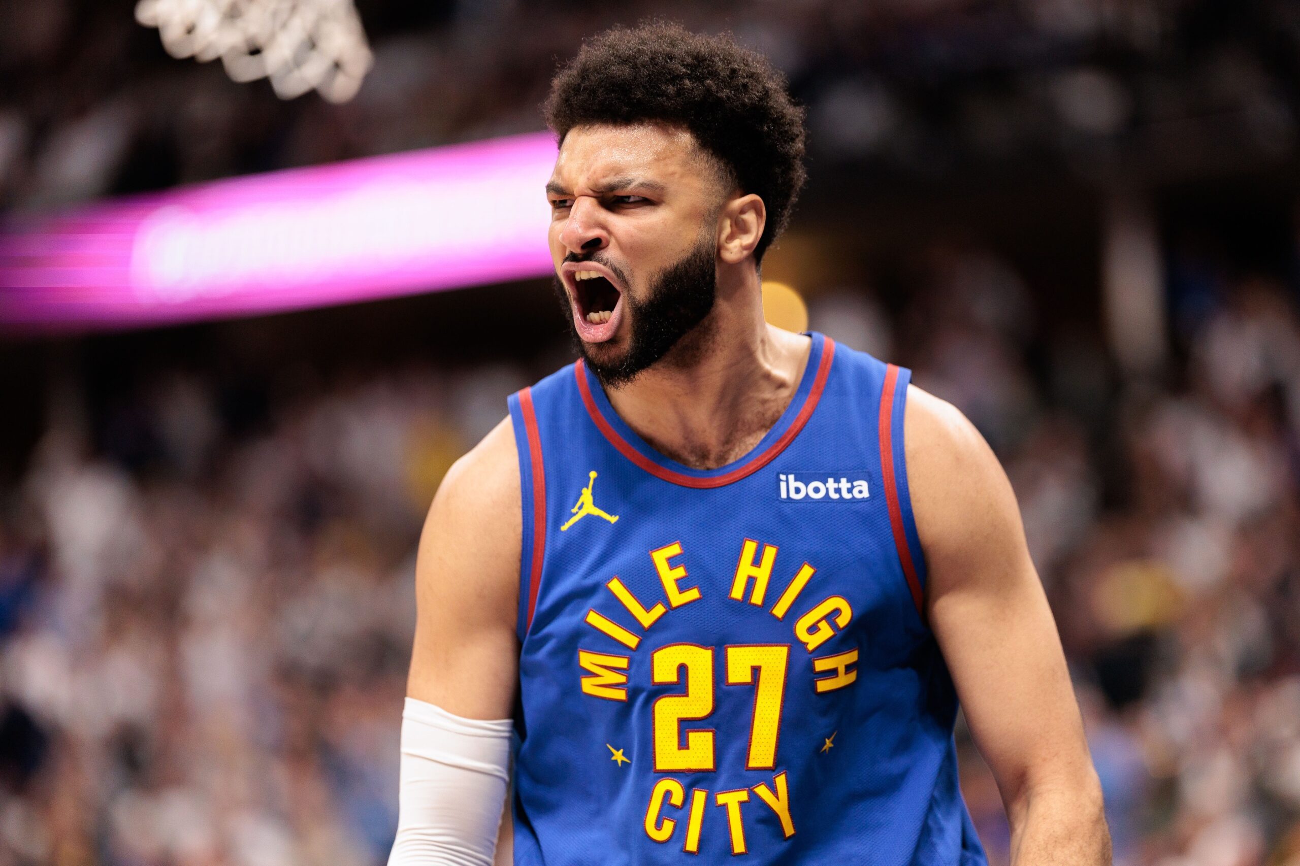 Apr 20, 2024; Denver, Colorado, USA; Denver Nuggets guard Jamal Murray (27) reacts to dunking the ball during the first quarter against the Los Angeles Lakers in game one of the first round for the 2024 NBA playoffs at Ball Arena. Mandatory Credit: Andrew Wevers-USA TODAY Sports
