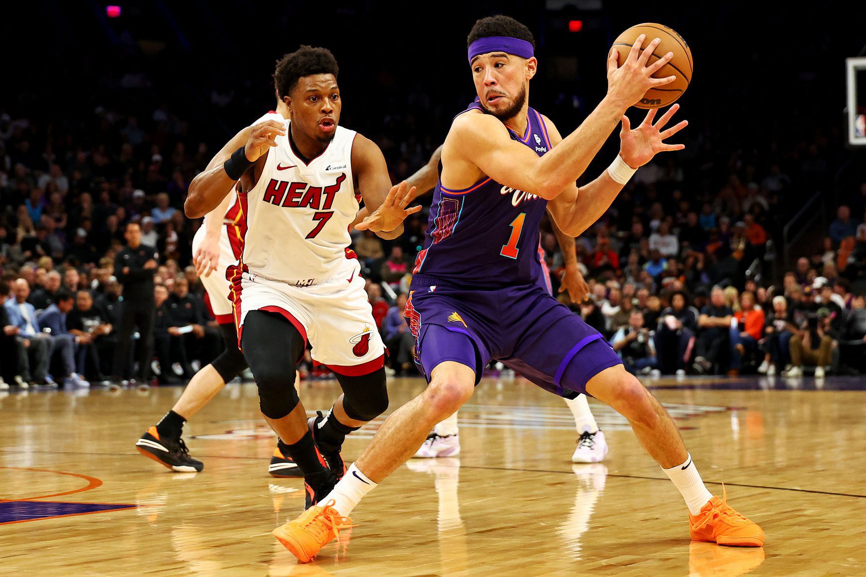 Phoenix Suns: New Kevin Durant Teammate Reveals Plan Ahead of 2024 NBA Season 2 Jan 5, 2024; Phoenix, Arizona, USA; Phoenix Suns guard Devin Booker (1) drives to the basket against Miami Heat guard Kyle Lowry (7) during the first quarter at Footprint Center. Mandatory Credit: Mark J. Rebilas-USA TODAY Sports