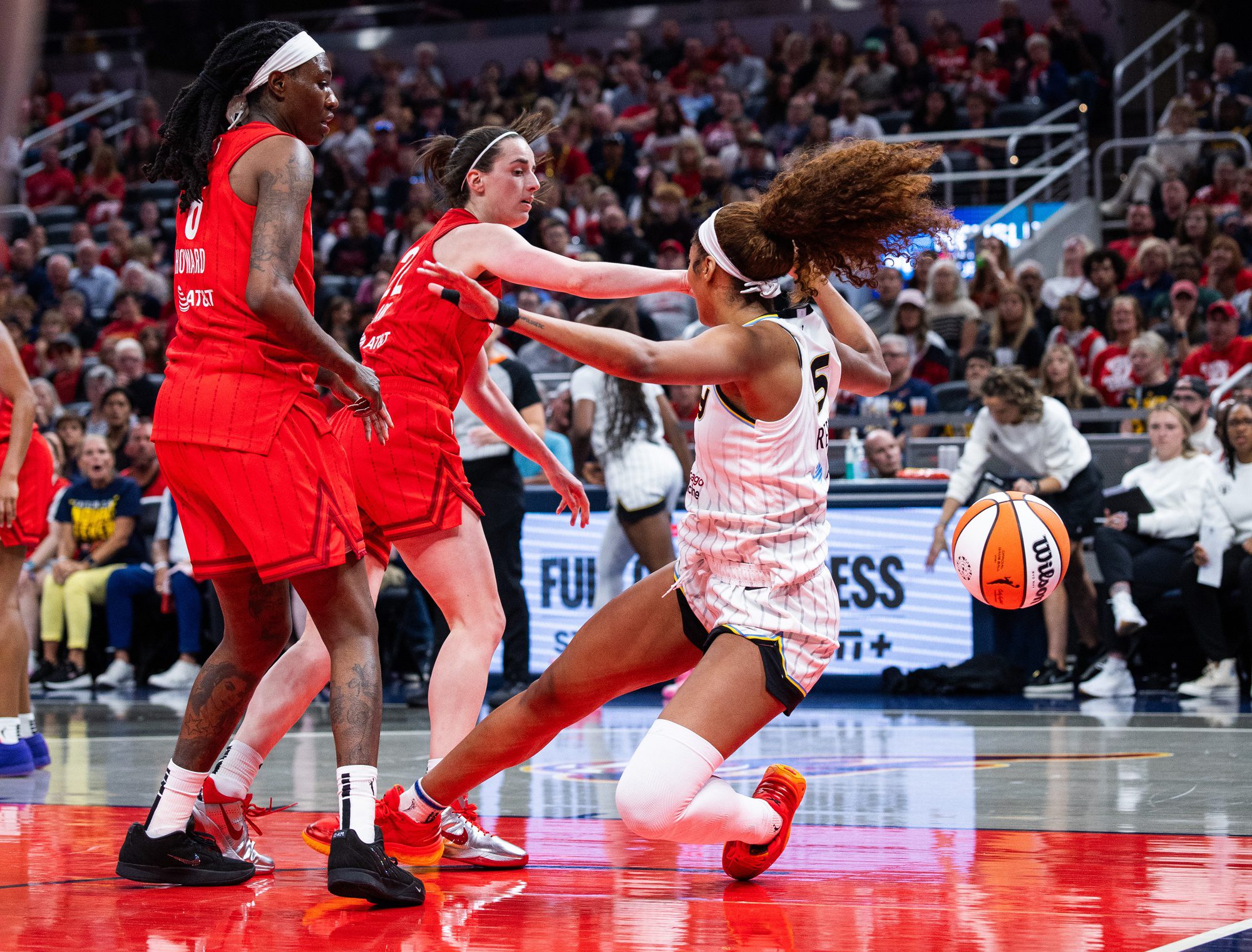 Indiana Fever guard Caitlin Clark (22) fouls Chicago Sky forward Angel Reese (5) in the second half at Gainbridge Fieldhouse.