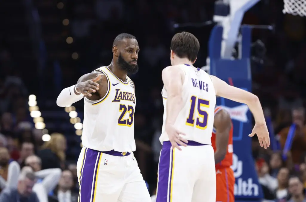 Los Angeles Lakers: Austin Reaves Defends LeBron James On 'Mickey Mouse' Championship Ring Criticism 2 Dec 23, 2023; Oklahoma City, Oklahoma, USA; Los Angeles Lakers forward LeBron James (23) and guard Austin Reaves (15) celebrate after a play against the Oklahoma City Thunder during the second half at Paycom Center. Mandatory Credit: Alonzo Adams-USA TODAY Sports
