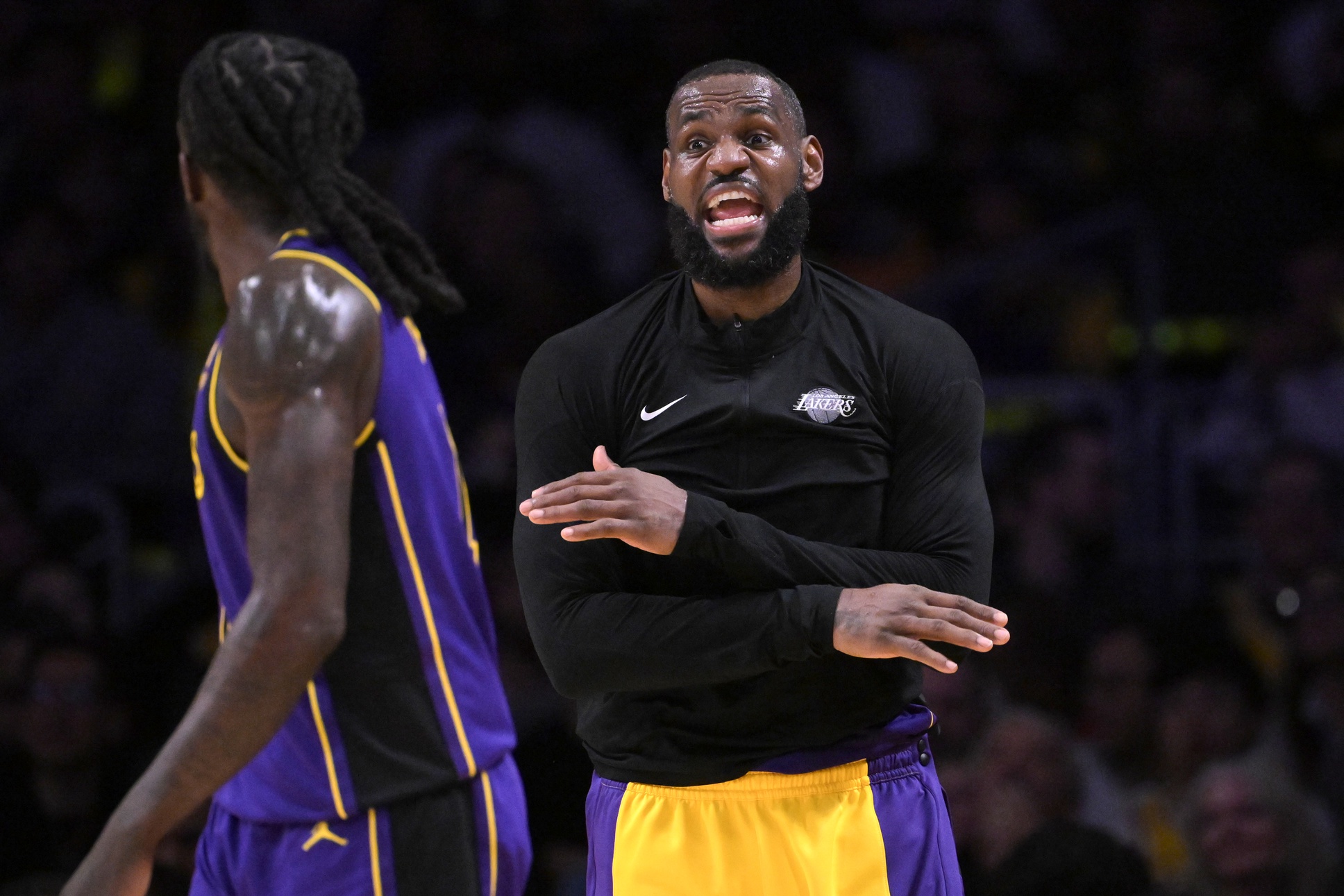 Jan 5, 2024; Los Angeles, California, USA; Los Angeles Lakers forward LeBron James (23) talks to forward Taurean Prince (12) from the bench in the second half against the Memphis Grizzlies at Crypto.com Arena. Mandatory Credit: Jayne Kamin-Oncea-USA TODAY Sports