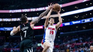 February 10th, 2024; Los Angeles, California, USA; Simone Fonteccino drives and shoots a floater against the Clippers defense. Mandatory Credit: Jayne Kamin-Oncea USA Today Sports