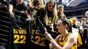 Iowa’s Caitlin Clark autographs jerseys for fans after game. Mandatory Credit: Joseph Kress-USA today.