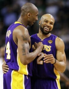 June 8th, 2010; Boston, Massachusetts, USA; Los Angeles Lakers guards Kobe Bryant, left, and Derek Fisher react during the fourth quarter in Game 3 of the NBA basketball finals against the Boston Celtics. Mandatory Credit: Michael Dwyer-AP Photo