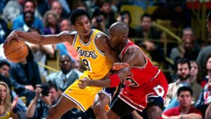 February 1, 1998; Los Angeles, California, USA; Kobe Bryant controls the ball against Michael Jordan. Mandatory Credit: Keith Birmingham-Getty Images