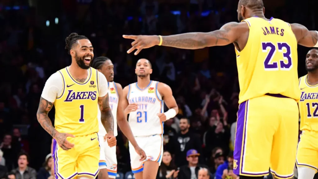 March 4th, 2024; Los Angeles, California, USA; D’Angelo Russell and LeBron James of the Los Angeles Lakers celebrates during the game against the Oklahoma City Thunder at Crypto.Com Arena. Mandatory Credit: Adam Pantozzi-Getty Images