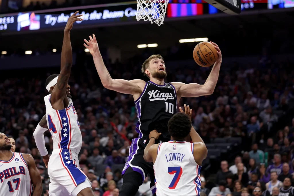 March 25, 2024; Sacramento, California, USA; Sacramento Kings forward Domantas Sabonis goes strong to the hoop against the Philadelphia 76ers at Golden 1 Center. Mandatory Credit: Sergio Estrada-USA TODAY Sports