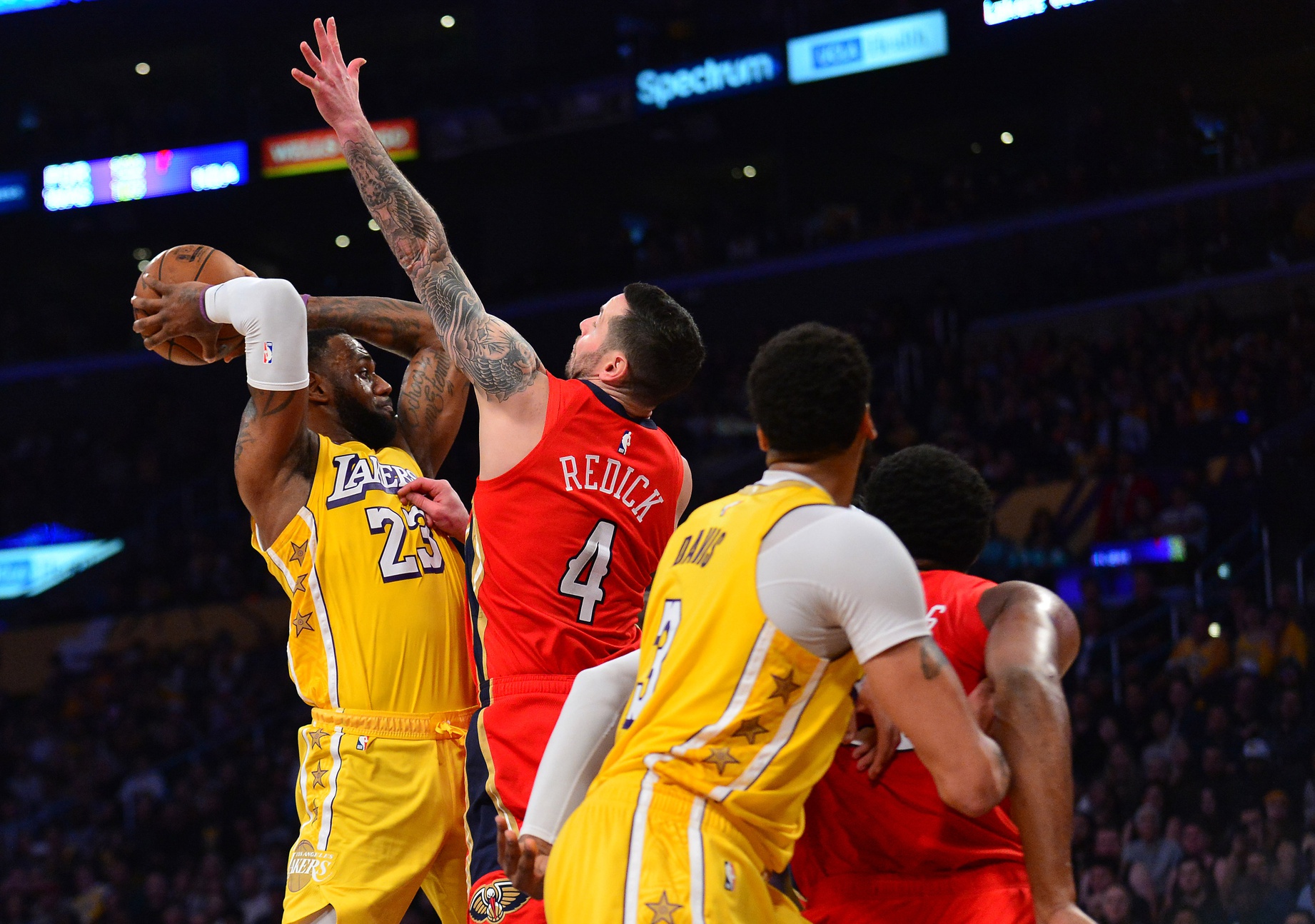 January 3, 2020; Los Angeles, California, USA; Los Angeles Lakers forward LeBron James (23) controls the ball against New Orleans Pelicans guard JJ Redick (4) during the second half at Staples Center. Mandatory Credit: Gary A. Vasquez-USA TODAY Sports