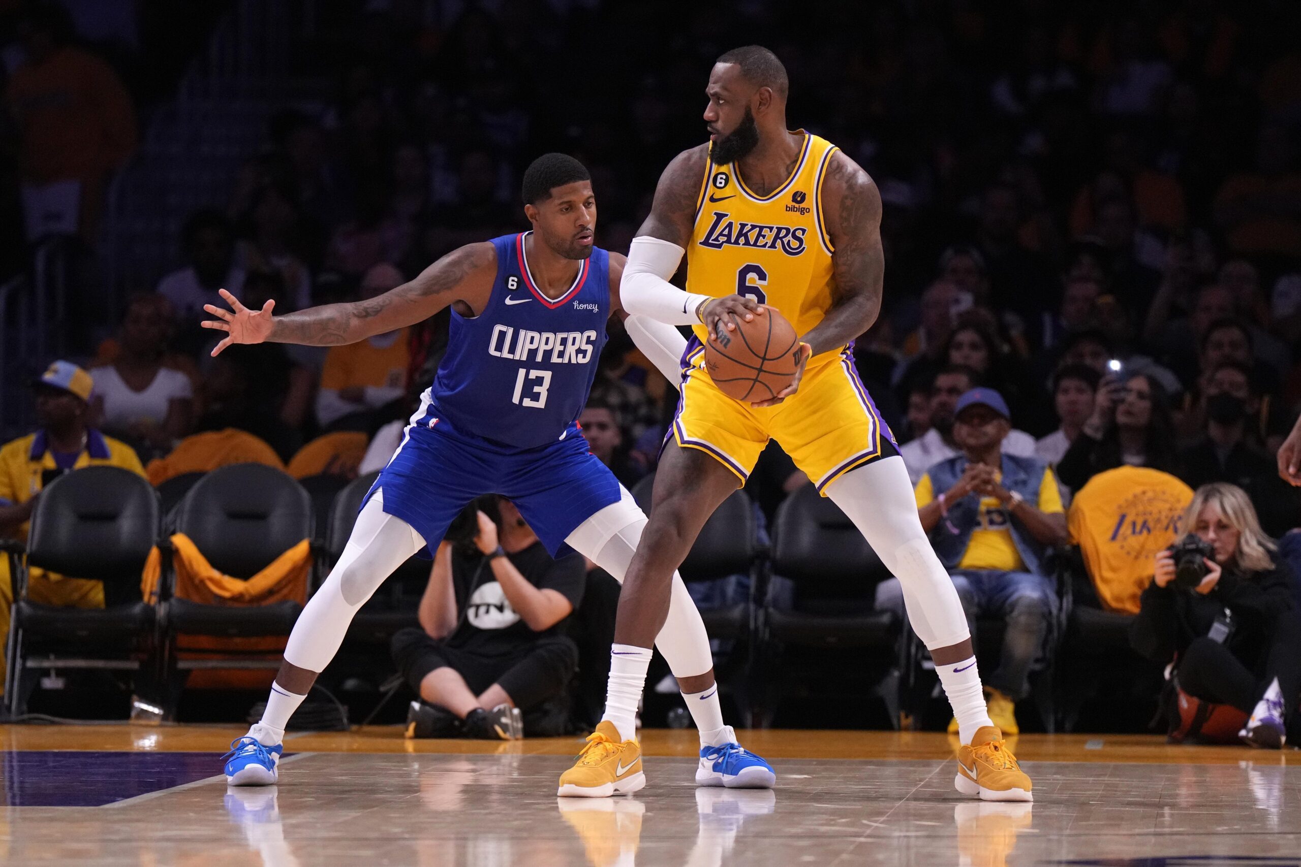 Oct 20, 2022; Los Angeles, California, USA; Los Angeles Lakers forward LeBron James (6) is defended by LA Clippers guard Paul George (13) in the second half at Crypto.com Arena. The Clippers defeated the Lakers 103-97. Mandatory Credit: Kirby Lee-USA TODAY Sports