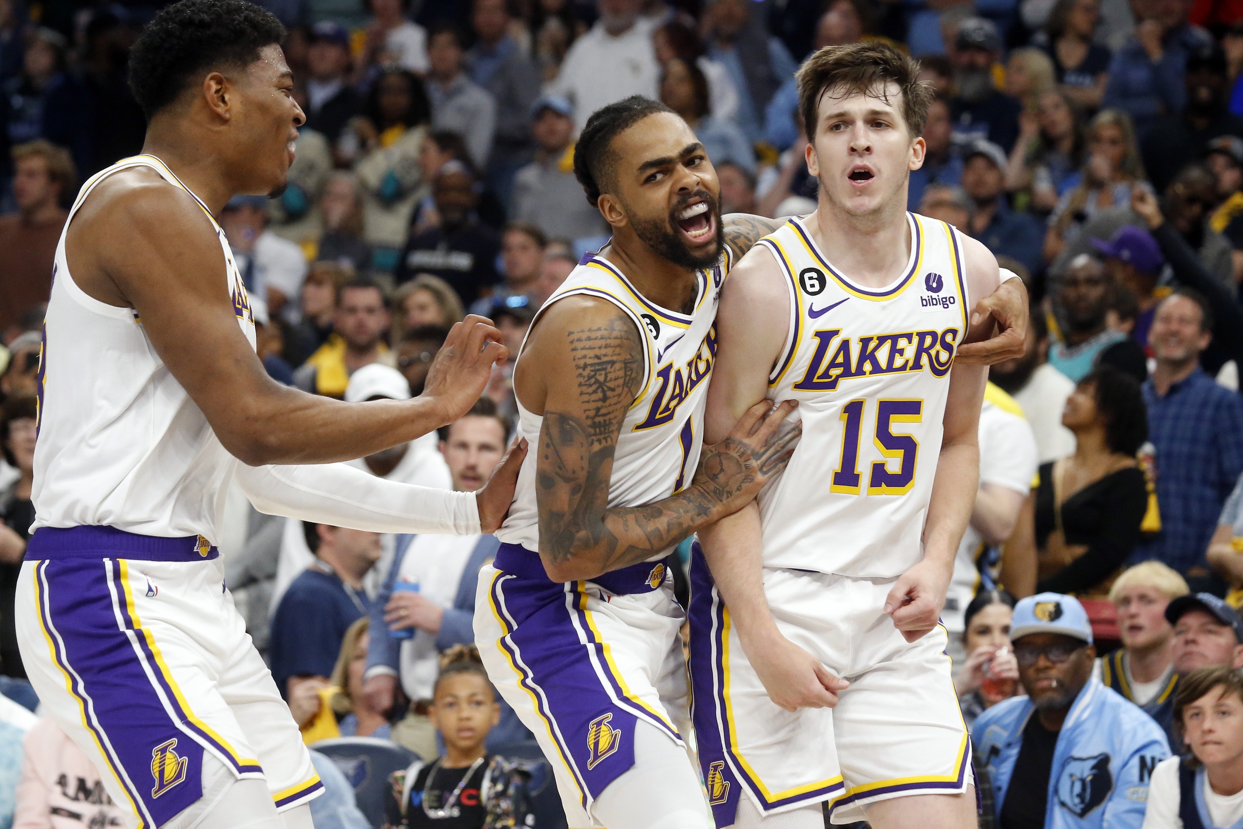 Apr 16, 2023; Memphis, Tennessee, USA; Los Angeles Lakers forward Rui Hachimura (28) and guard D'Angelo Russell (1) react with guard Austin Reaves (15) during the second half during game one of the 2023 NBA playoffs against the Memphis Grizzlies at FedExForum. Mandatory Credit: Petre Thomas-USA TODAY Sports