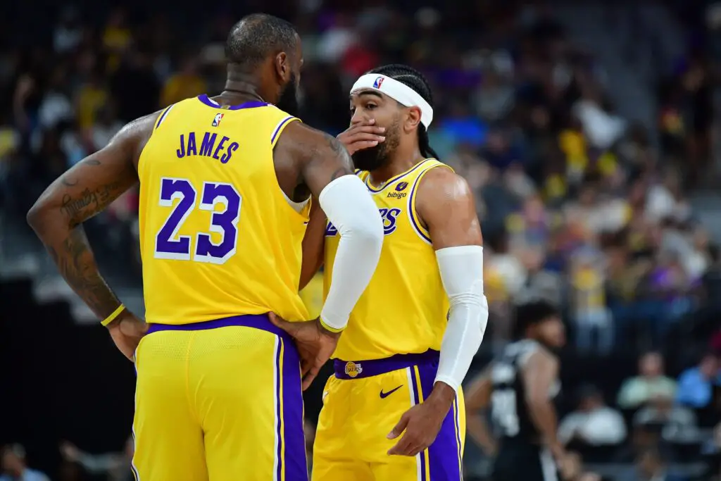Oct 9, 2023; Las Vegas, Nevada, USA; Los Angeles Lakers forward LeBron James (23) speaks with guard Gabe Vincent (7) during the first half at T-Mobile Arena. Mandatory Credit: Gary A. Vasquez-USA TODAY Sports