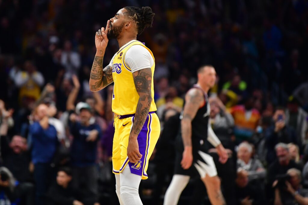 Feb 28, 2024; Los Angeles, California, USA; Los Angeles Lakers guard D'Angelo Russell (1) reacts after scoring a three point basket against the Los Angeles Clippers during the second half at Crypto.com Arena. Mandatory Credit: Gary A. Vasquez-USA TODAY Sports