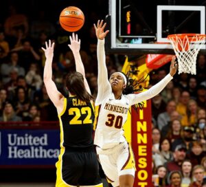 February 28th, 2024; Minneapolis, Minnesota, USA; Iowa Hawkeyes guard Caitlin Clark shoots from deep against the Minnesota Golden Gophers at Williams Arena. Mandatory Credit: Nick Wosika-USA TODAY Sports