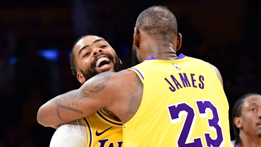 D’Angelo Russell and LeBron James of the Los Angeles Lakers celebrates during the game against the Oklahoma City Thunder at Crypto.Com Arena. Mandatory Credit: Adam Pantozzi-Getty Images
