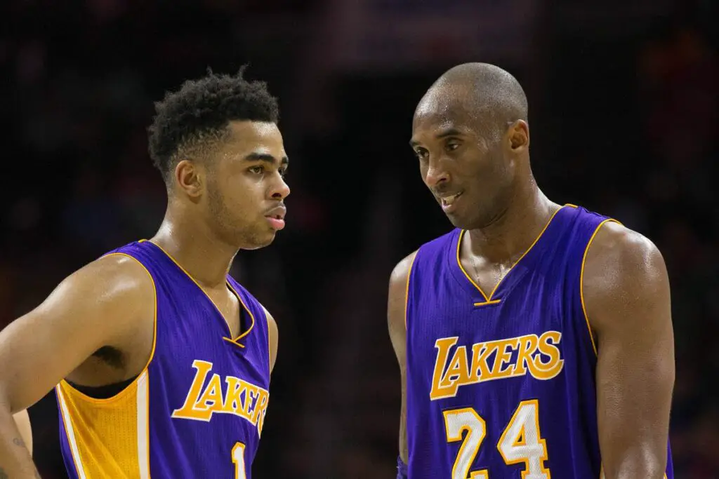Jan 24th, 2016; Portland, Oregon, USA; Los Angeles Lakers guards Kobe Bryant and D’Angelo Russell talk at center court during the loss to Trail Blazers at the Moda Center. Mandatory Credit: Bill Streicher-USA TODAY Sports
