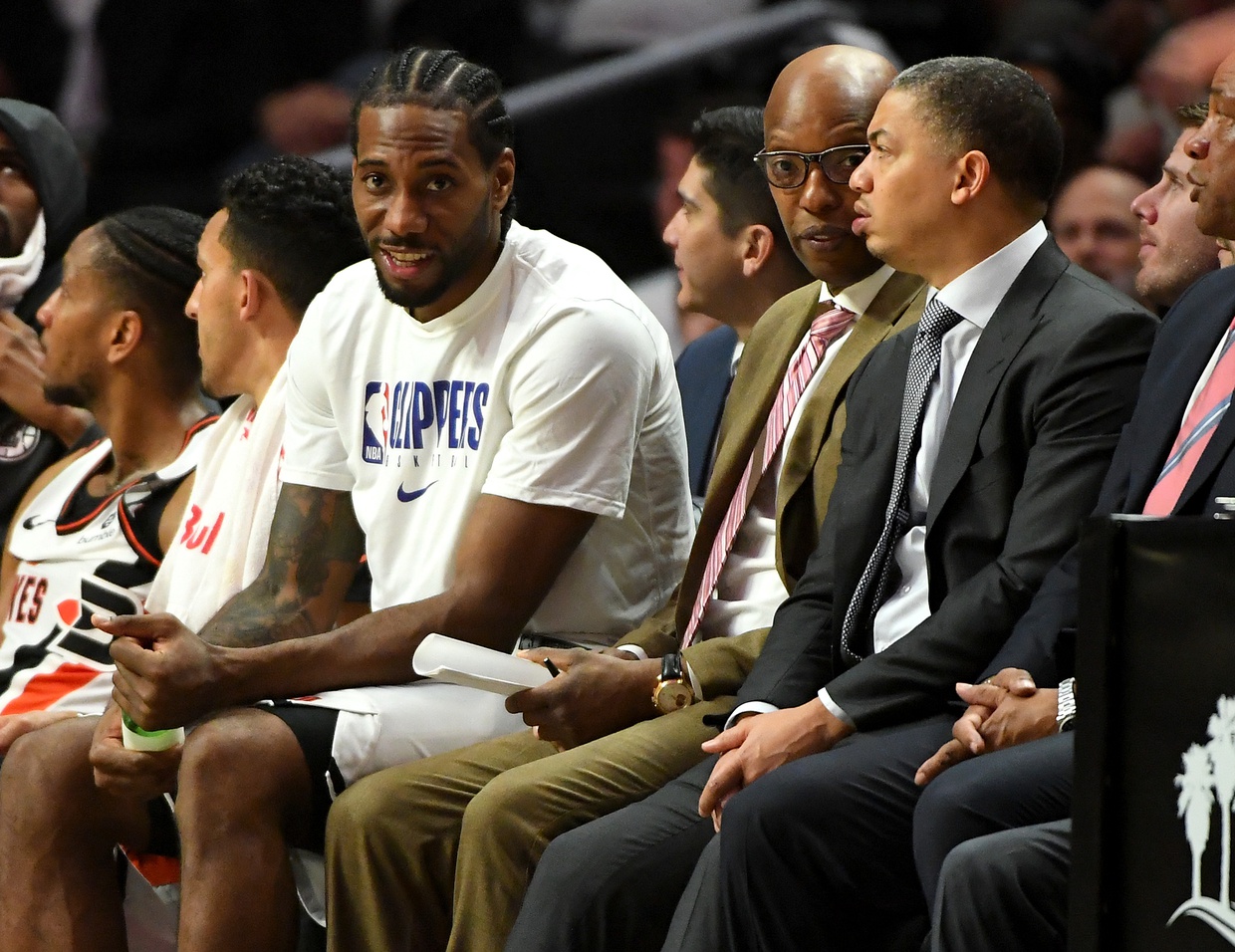 Jan 14, 2020; Los Angeles, California, USA; Los Angeles Clippers forward Kawhi Leonard (2) talks to coaches Sam Cassell and Tyronn Lue on the bench in the second half of the game against the Cleveland Cavaliers at Staples Center. Mandatory Credit: Jayne Kamin-Oncea-USA TODAY Sports