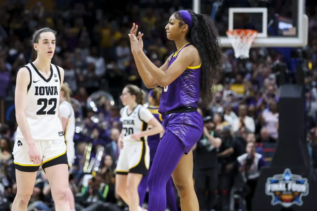 Apr 2, 2023; Dallas, TX, USA; LSU Lady Tigers forward Angel Reese (10) gestures towards Iowa Hawkeyes guard Caitlin Clark (22) in the second half during the final round of the Women's Final Four NCAA tournament at the American Airlines Center. Mandatory Credit: Kevin Jairaj-USA TODAY Sports