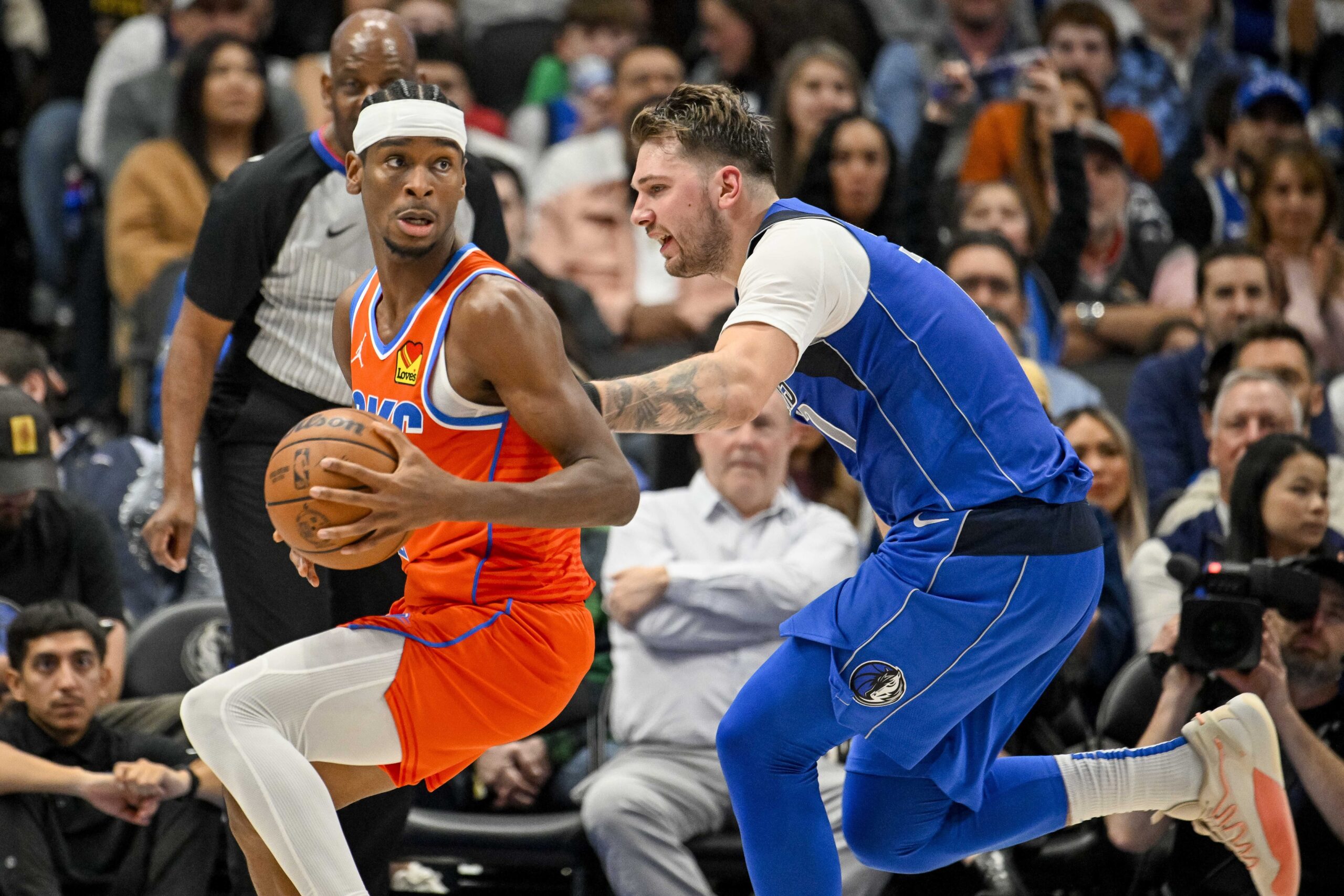 Dec 2, 2023; Dallas, Texas, USA; Oklahoma City Thunder guard Shai Gilgeous-Alexander (2) and Dallas Mavericks guard Luka Doncic (77) in action during the game between the Dallas Mavericks and the Oklahoma City Thunder at the American Airlines Center. Mandatory Credit: Jerome Miron-USA TODAY Sports