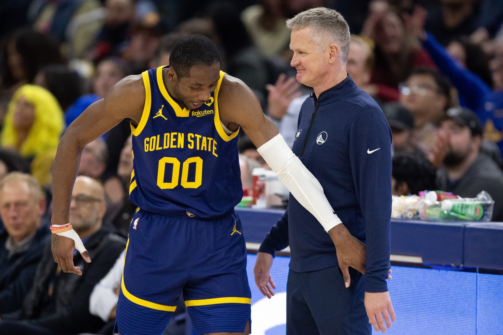 Jan 25, 2024; San Francisco, California, USA; Golden State Warriors forward Jonathan Kuminga (00) reacts after a foul with head coach Steve Kerr against the Sacramento Kings during the second quarter at Chase Center. Mandatory Credit: D. Ross Cameron-USA TODAY Sports