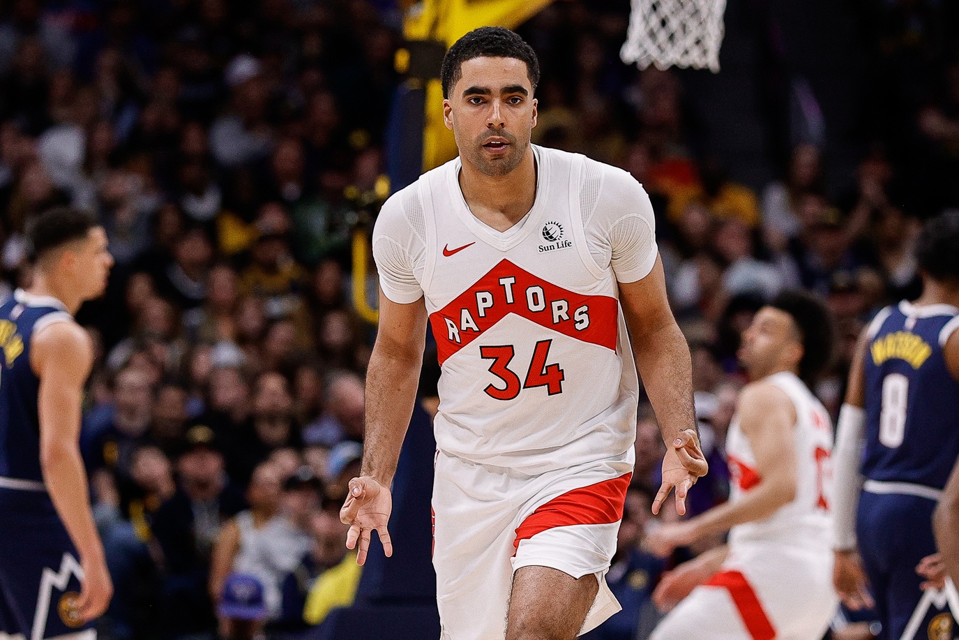 Mar 11, 2024; Denver, Colorado, USA; Toronto Raptors center Jontay Porter (34) reacts after a play in the third quarter against the Denver Nuggets at Ball Arena. Mandatory Credit: Isaiah J. Downing-USA TODAY Sports