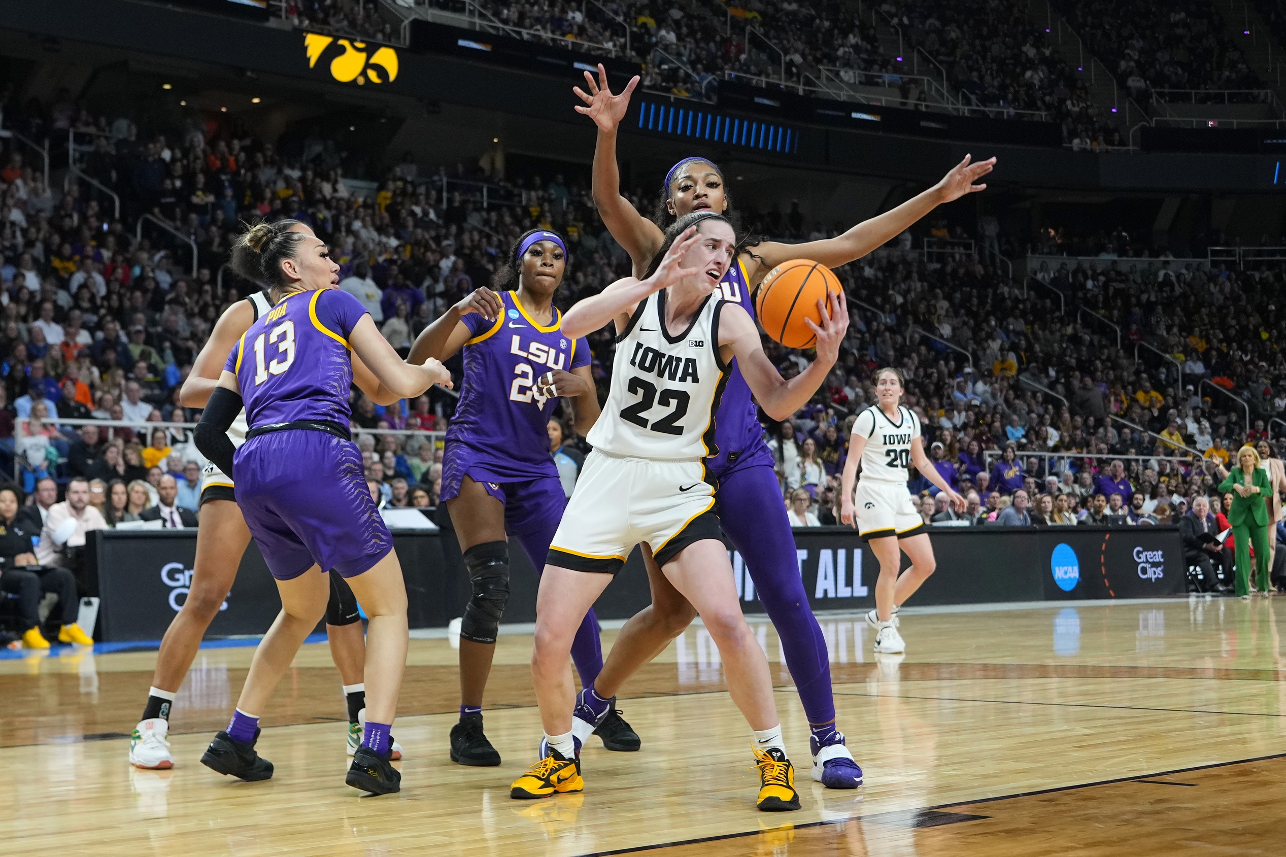 Apr 1, 2024; Albany, NY, USA; Iowa Hawkeyes guard Caitlin Clark (22) fights for control against LSU Lady Tigers forward Angel Reese (10) in the fourth quarter in the finals of the Albany Regional in the 2024 NCAA Tournament at MVP Arena. Mandatory Credit: Gregory Fisher-USA TODAY Sports