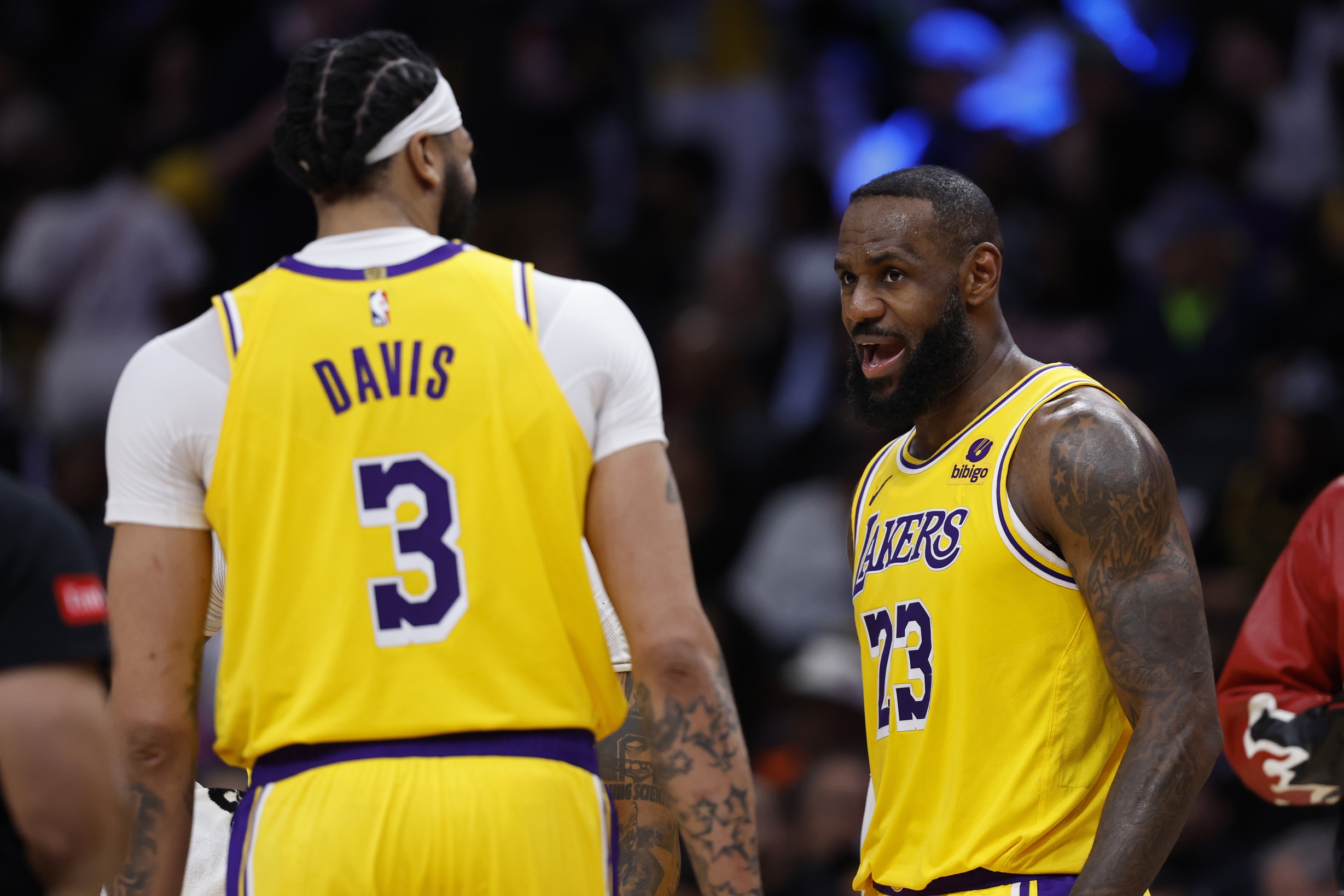 Apr 3, 2024; Washington, District of Columbia, USA; Los Angeles Lakers forward LeBron James (23) talks with Lakers forward Anthony Davis (3) during a timeout against the Washington Wizards in the second half at Capital One Arena. Mandatory Credit: Geoff Burke-USA TODAY Sports