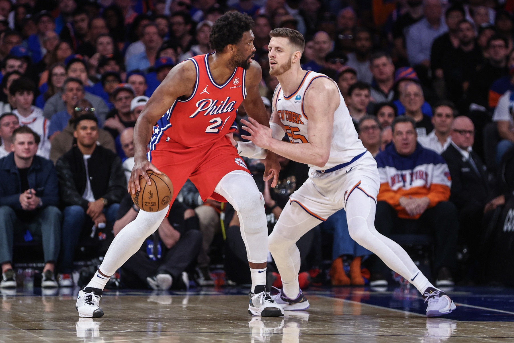 Apr 20, 2024; New York, New York, USA; Philadelphia 76ers center Joel Embiid (21) looks to post up against New York Knicks center Isaiah Hartenstein (55) in the third quarter in game one of the first round for the 2024 NBA playoffs at Madison Square Garden. Mandatory Credit: Wendell Cruz-USA TODAY Sports