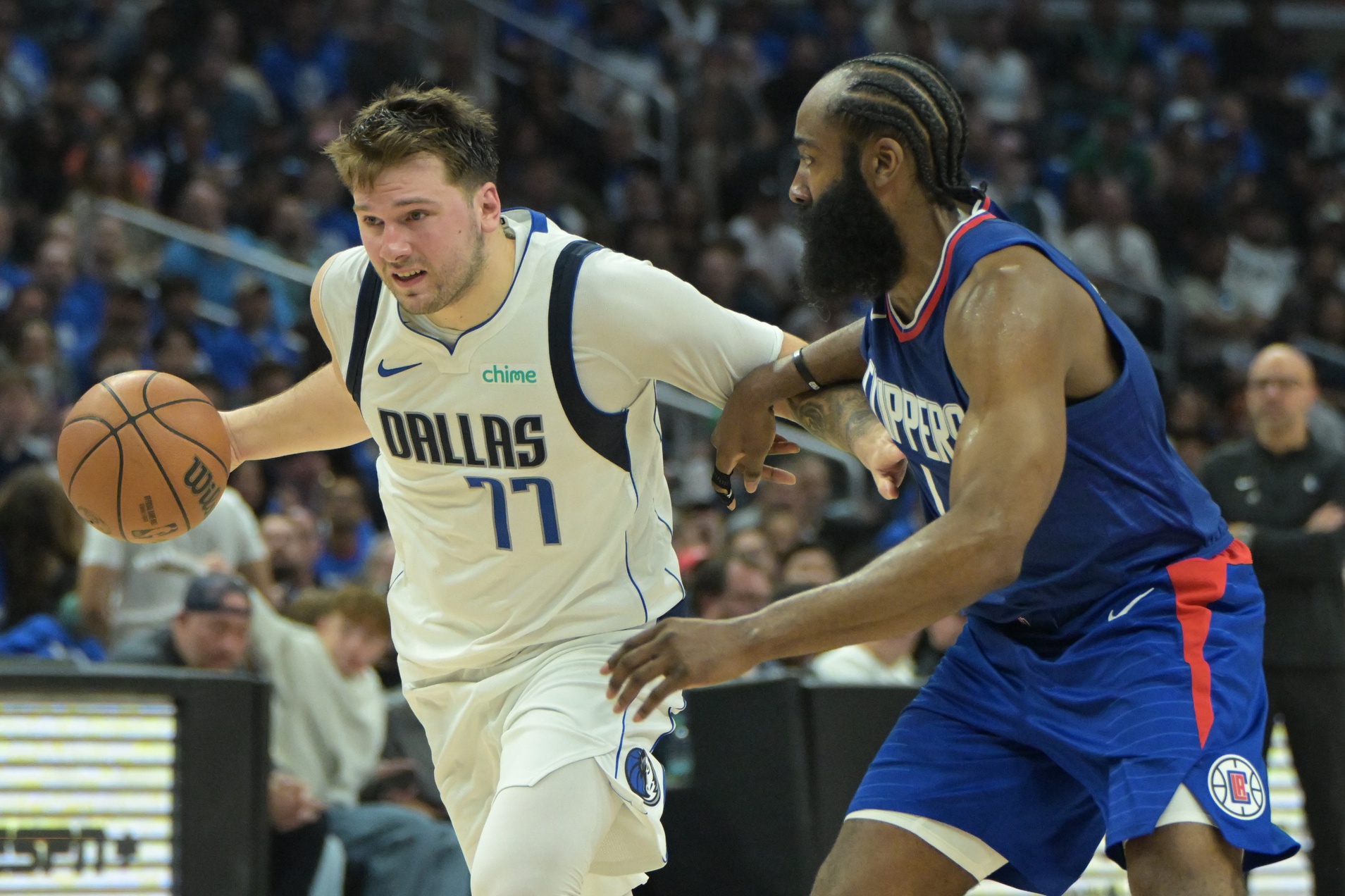 Apr 21, 2024; Los Angeles, California, USA; Dallas Mavericks guard Luka Doncic (77) is defended by Los Angeles Clippers guard James Harden (1) in the second half of game one of the first round for the 2024 NBA playoffs at Crypto.com Arena. Mandatory Credit: Jayne Kamin-Oncea-USA TODAY Sports