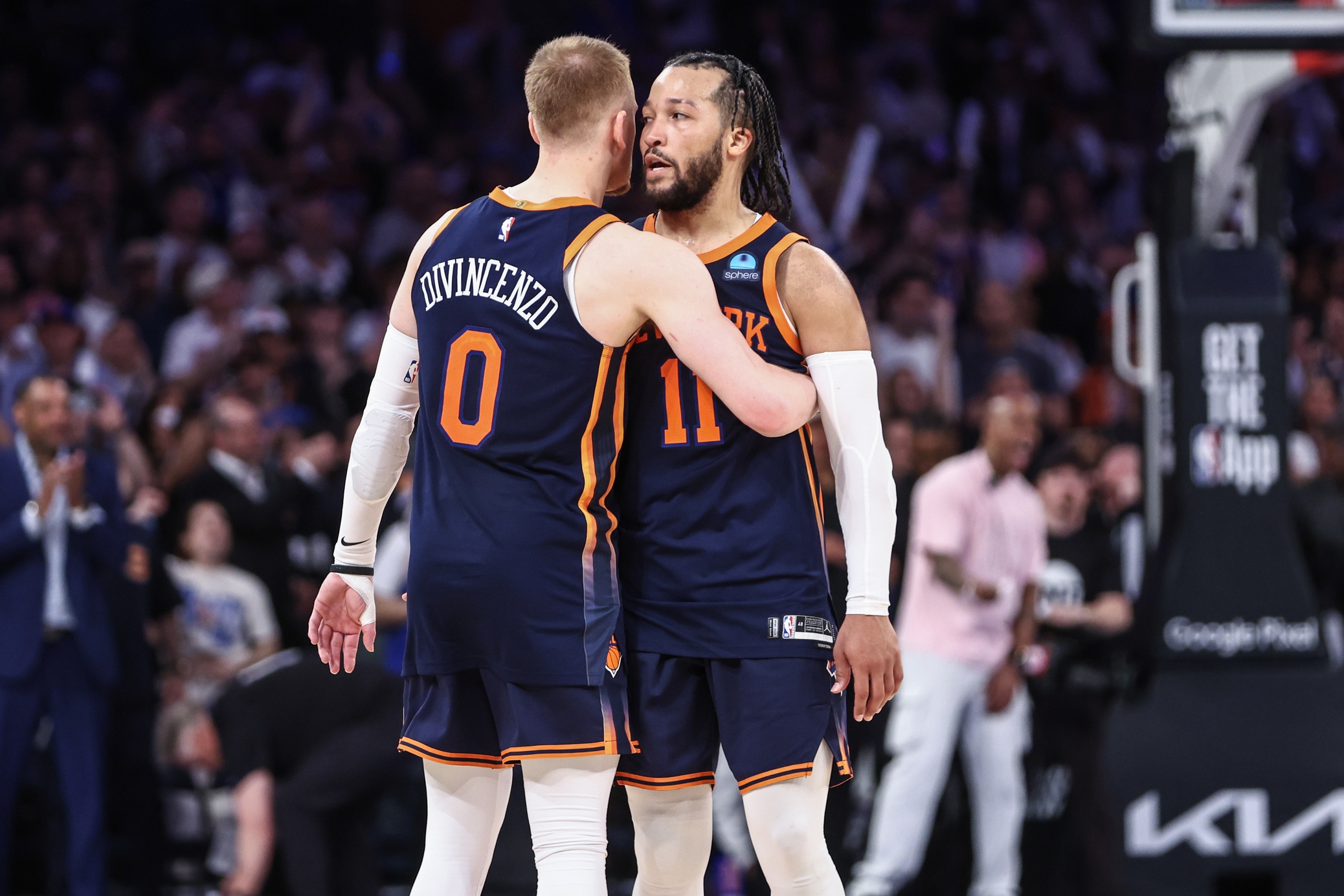 May 8, 2024; New York, New York, USA; New York Knicks guards Donte DiVincenzo (0) and Jalen Brunson (11) embrace after defeating the Indiana Pacers 130-121 in game two of the second round for the 2024 NBA playoffs at Madison Square Garden. Mandatory Credit: Wendell Cruz-USA TODAY Sports