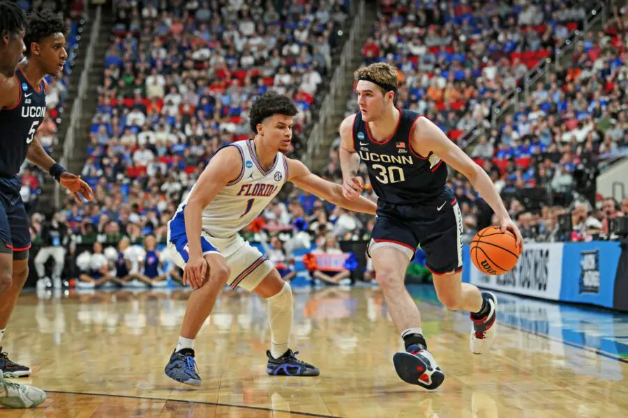 UCONN-Florida: Jaw-Dropping Female Fan Identified As Mother Of Player (Report) 2 Mar 23, 2025; Raleigh, NC, USA; Connecticut Huskies forward Liam McNeeley (30) drives to the basket during the second half against Florida Gators guard Walter Clayton Jr. (1) in the second round of the NCAA Tournament at Lenovo Center. Mandatory Credit: Zachary Taft-Imagn Images Uconn